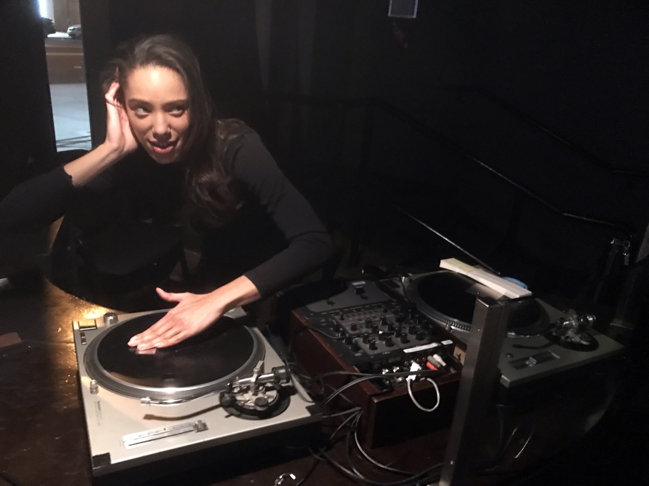 A picture of Sidney Simone being the DJ at a party.