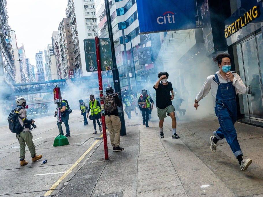 People seen running away from tear gas which fired by police during the anti national security bill demonstration in Hong Kong. Alda Tsang / Echoes Wire/Barcroft 