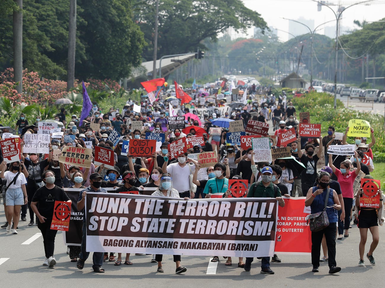 Protesters hold slogans during a rally calling on legislators to junk the proposed anti-terror bill in Manila, Philippines, on Thursday June 4, 2020. Aaron Favila / ASSOCIATED PRESS