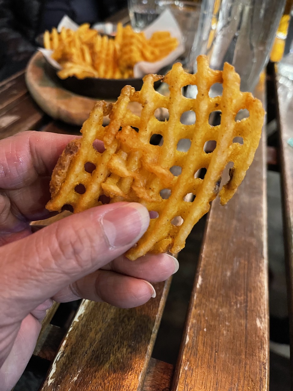 A Picture of william fuentes holding a Waffle Frie