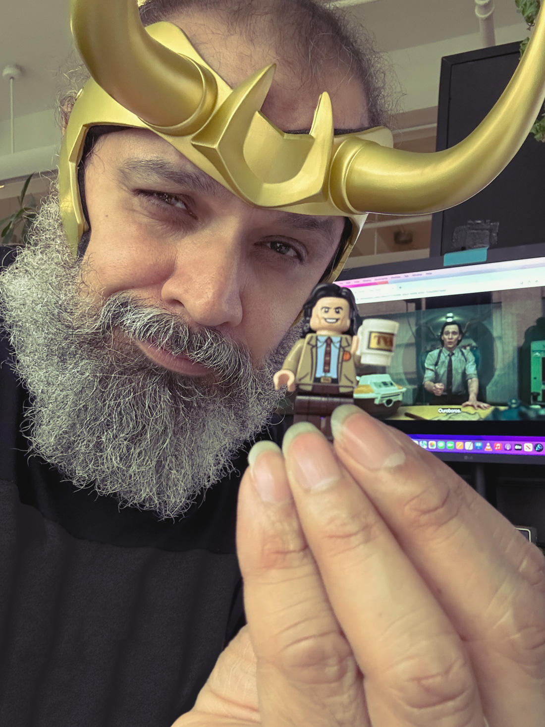 Picture Of William Fuentes Wearing Loki Season 2 Horns and a lego of Loki